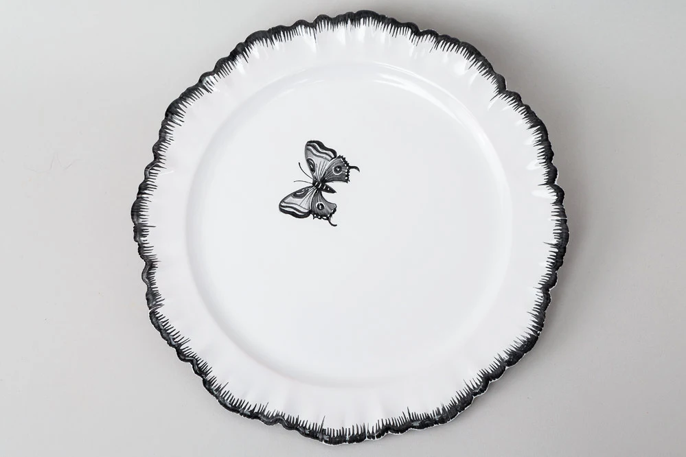 Dinner plate with black butterfly motif