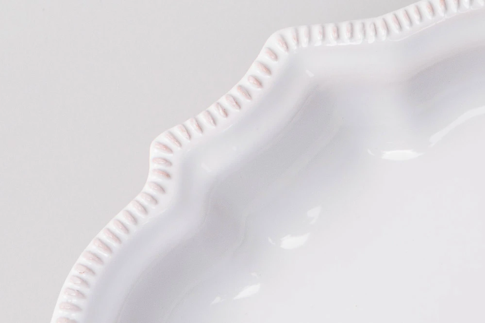 Detail of small pearled platter in white