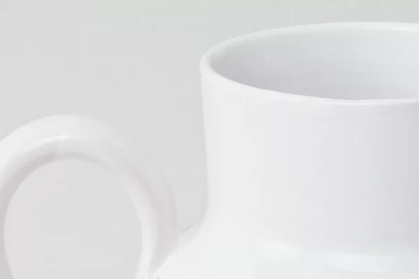 Detail of round pitcher in white