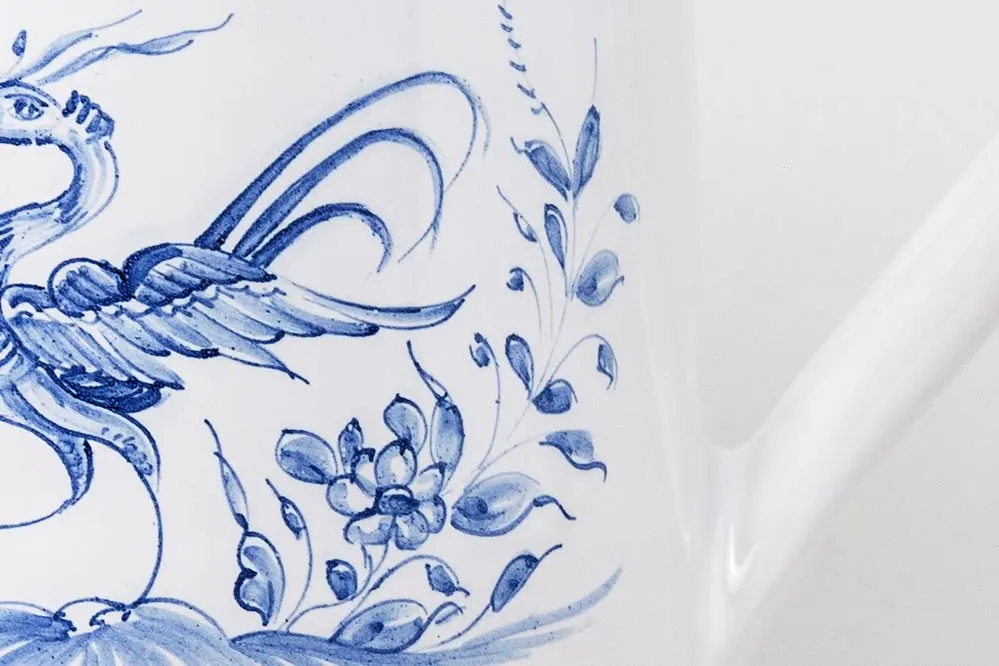 Detail of straight pitcher with blue bird motif