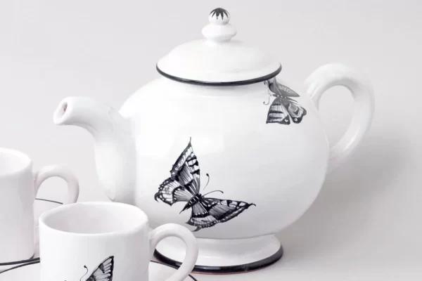 Round teapot with black butterflies motif